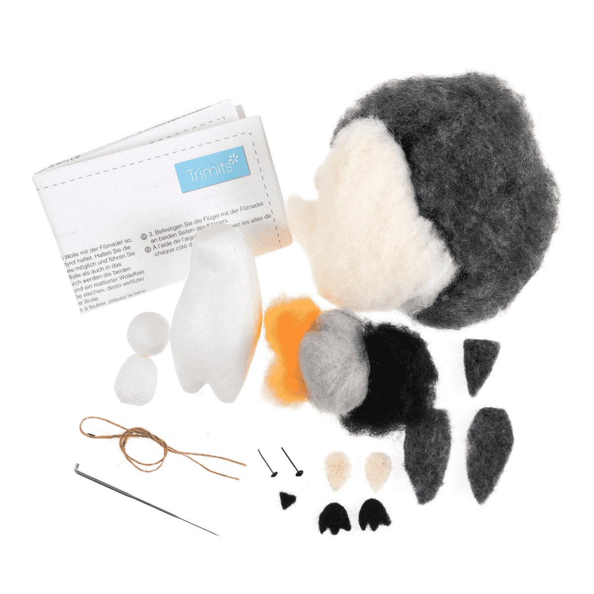 Felt animal craft kit with pieces and instructions on a white background