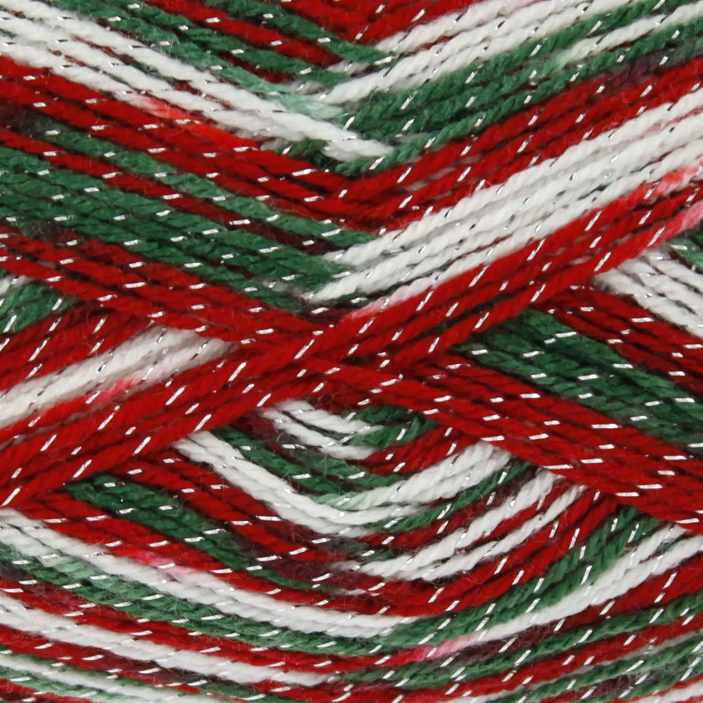 Close-up of red, green, and white yarn strands