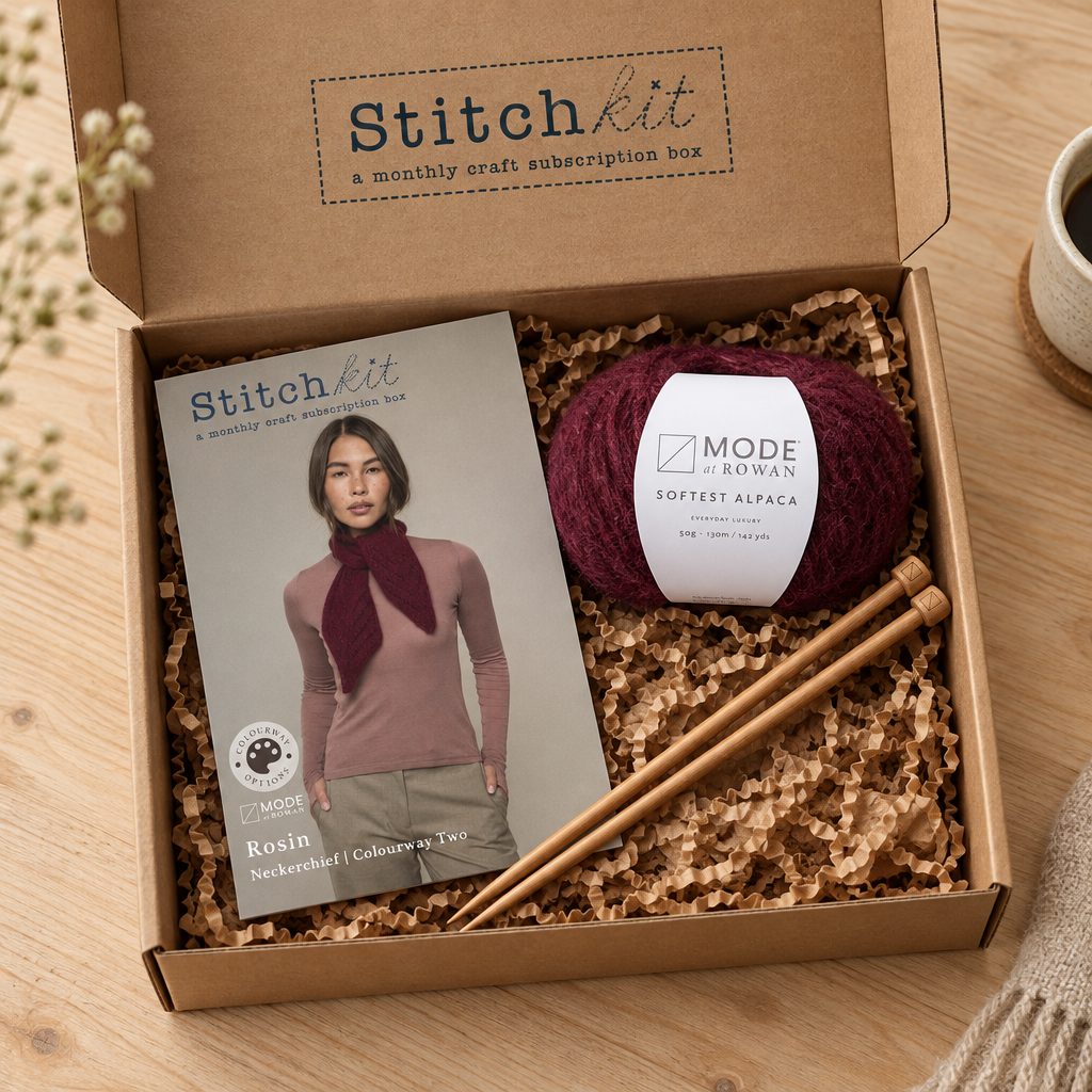 Rosin knitting kit with burgundy alpaca yarn and knitting needles in a Stitch Kit box