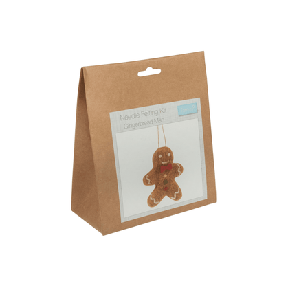 Kraft paper bag with a gingerbread man ornament and 'Needle Felting Kit' text on a white background