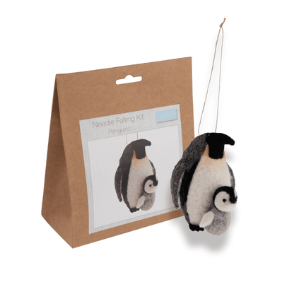 Penguin needle felting kit with felted penguin and packaging on a white background